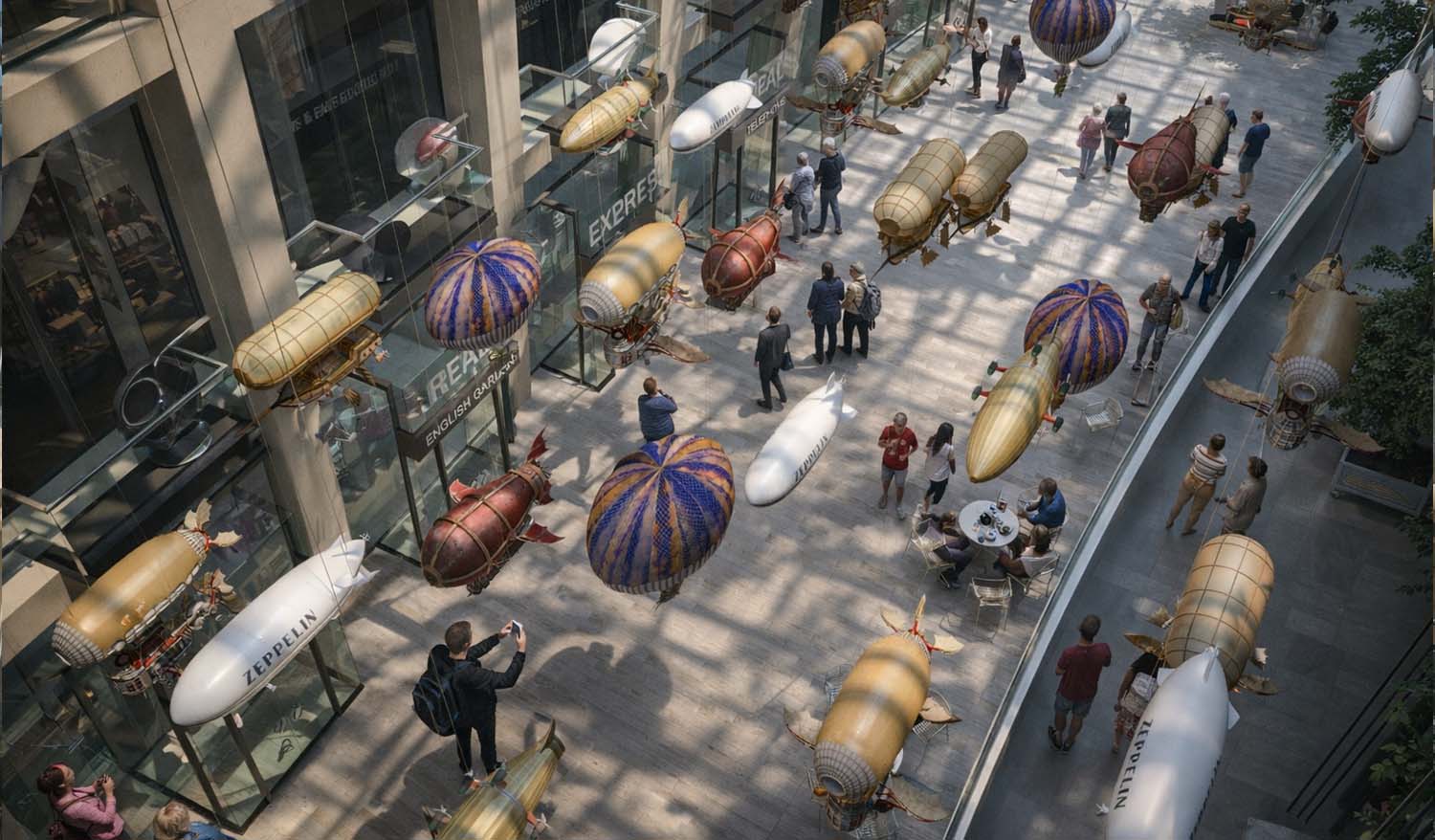 Вид сверху на интерактивное пространство терминала, где над галереей с магазинами парят миниатюрные дирижабли и аэростаты, привлекая внимание посетителей.